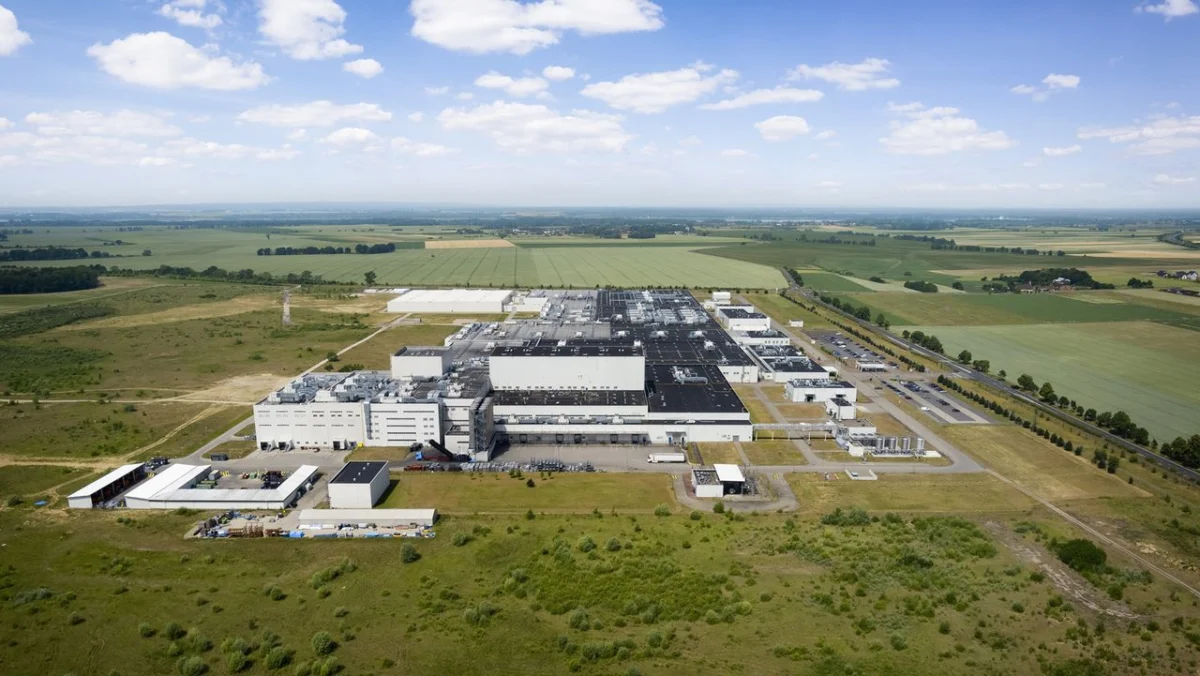 A large factory among arable fields