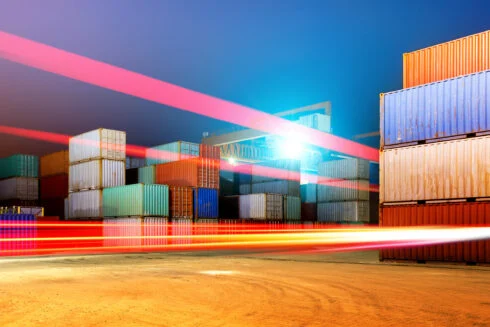 Container,Terminal,At,Night,,Working,In,The,Bridge,Crane.