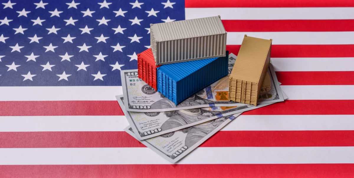 Cargo,Containers,On,The,Us,Flag,As,A,Conceptual,Backdrop