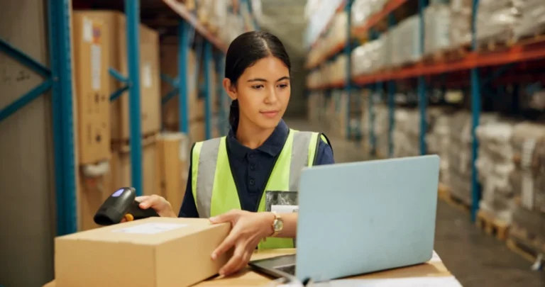Laptop,,Qr,Code,And,Inventory,With,Woman,Scanning,Box,In